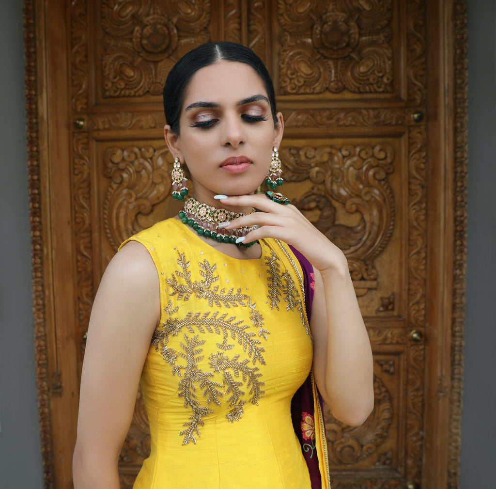 Yellow and purple Begum Kurti set by Couture Mantra, featuring a traditional pajami suit with intricate design details.