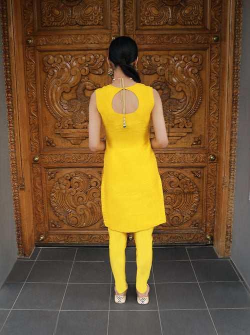 Yellow and purple Begum Kurti set with pajami suit styling from Couture Mantra, featuring intricate embroidery and traditional design.