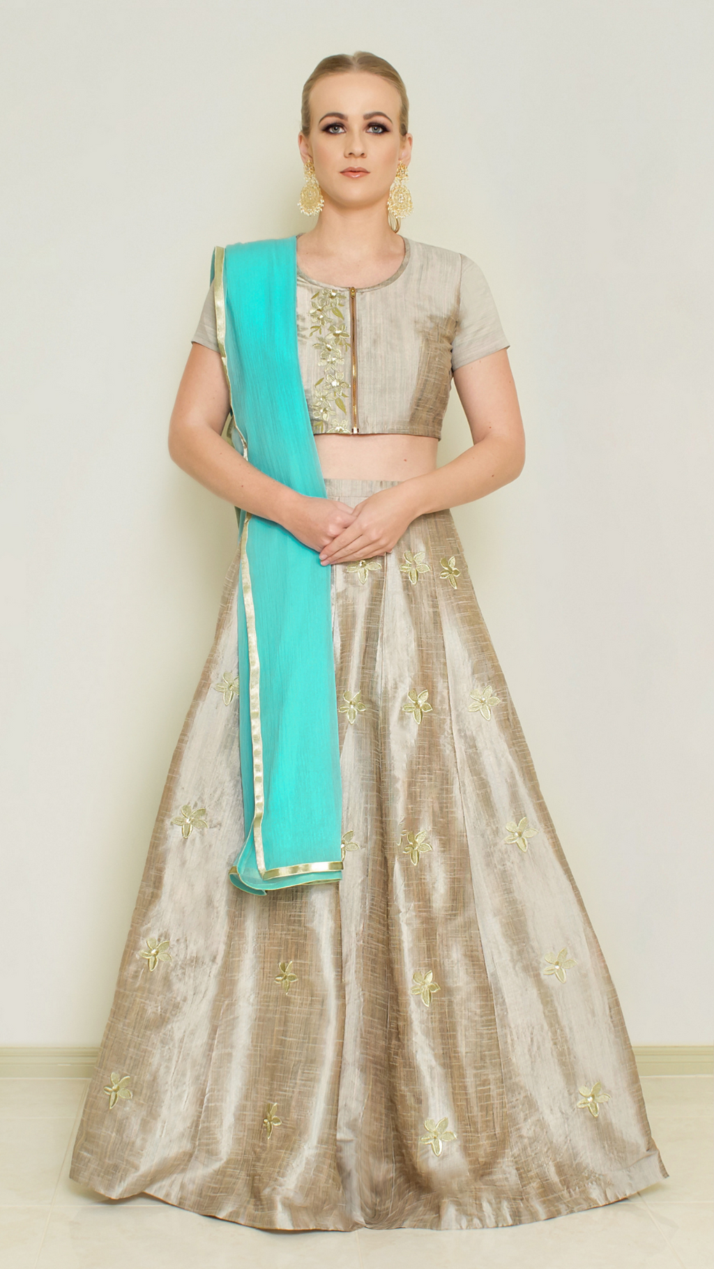 Stone grey Pineapple Lehenga Set by Nakir, featuring intricate embroidery and traditional design, worn by a model.