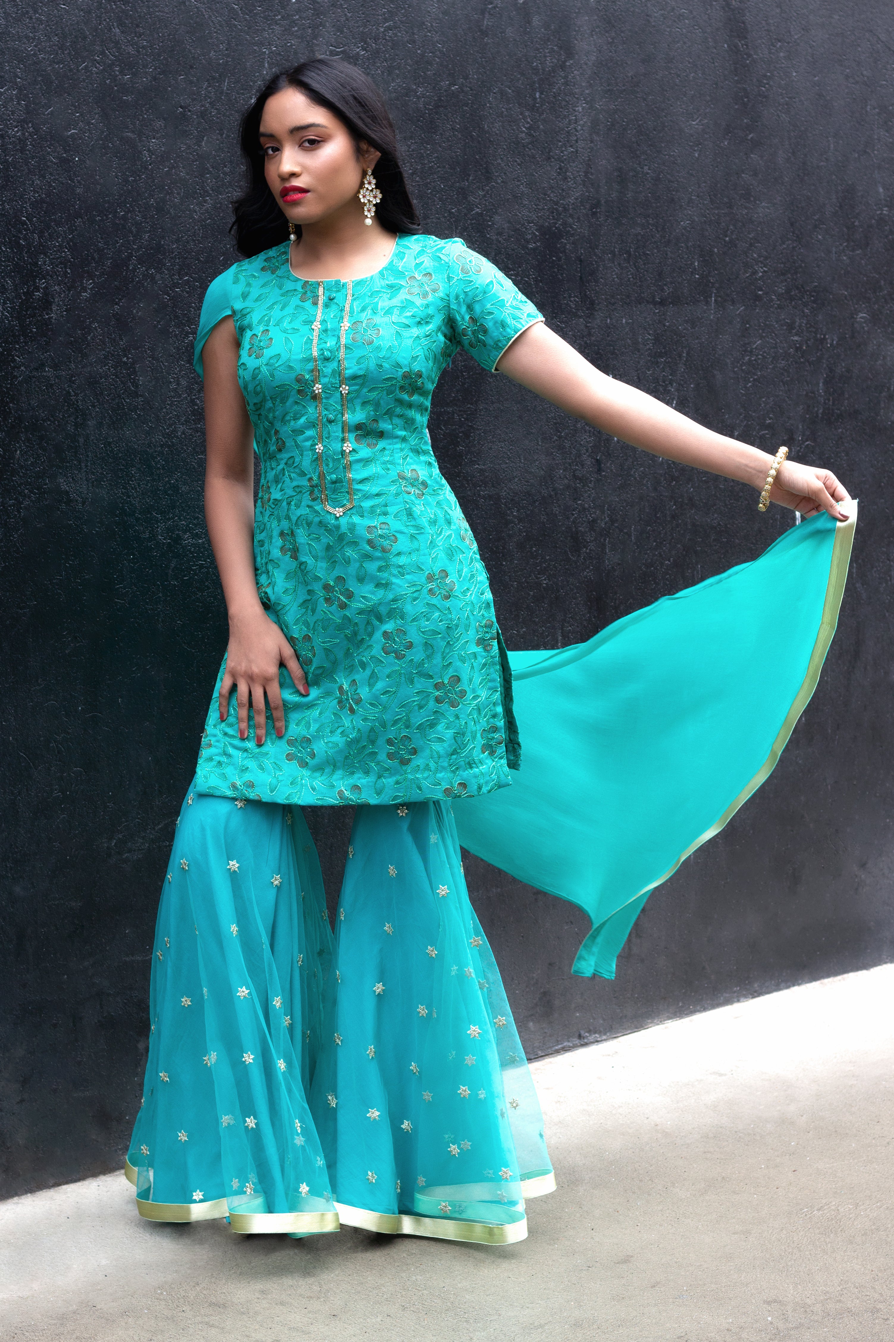 Cotton Mul Gharara set by Couture Mantra featuring a traditional sharara with intricate embroidery and vibrant colors.