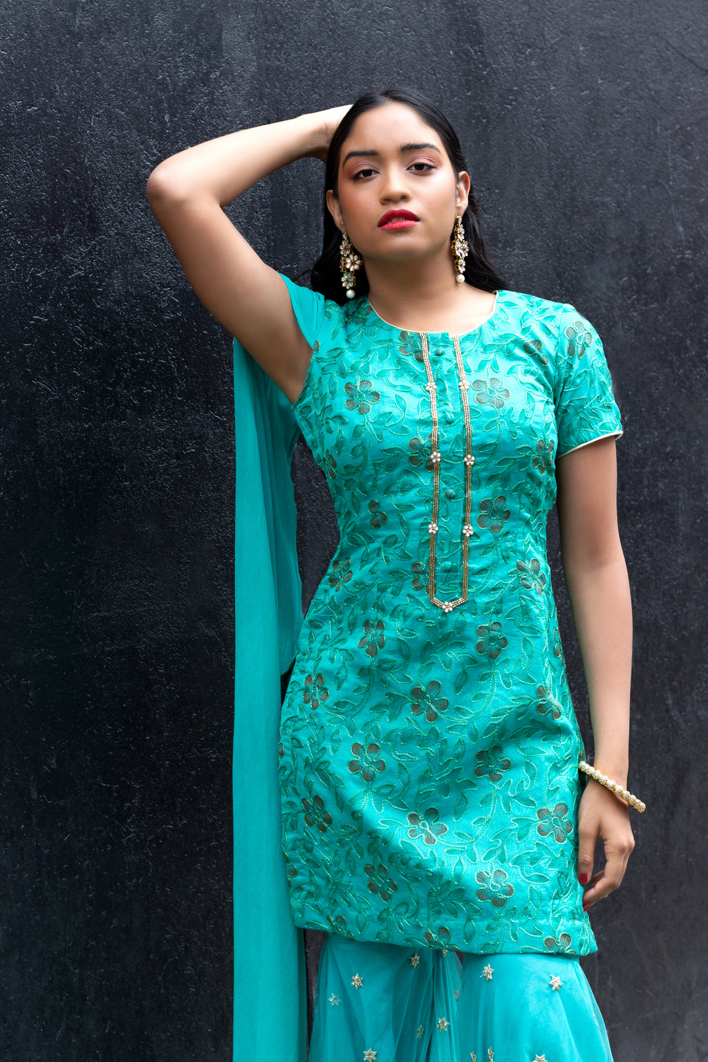 Cotton Mul Gharara set by Couture Mantra, featuring a traditional sharara with intricate embroidery and matching top.