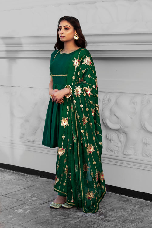 Couture Mantra Begum Frock Set featuring a traditional frock with intricate embroidery and vibrant fabric, ideal for festive occasions.