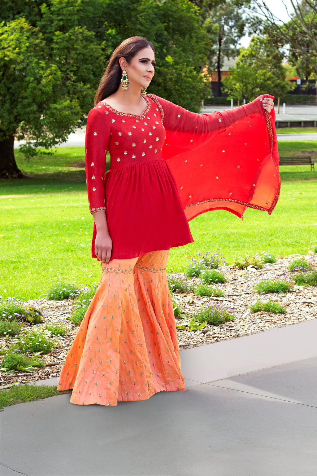 Mulberry green sharara set with intricate embroidery from Couture Mantra, featuring a flowing gharara and matching top.