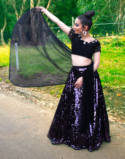 Black Devine Silhouette Lehenga by Anshika, featuring intricate embroidery and traditional design, displayed on a mannequin.