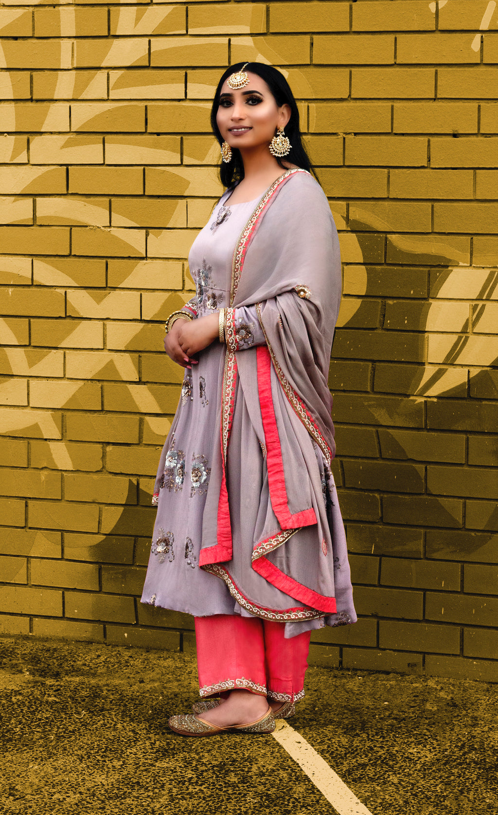 Vogue Frock set by Couture Mantra featuring a stylish, colorful traditional dress with intricate embroidery and flowing fabric.
