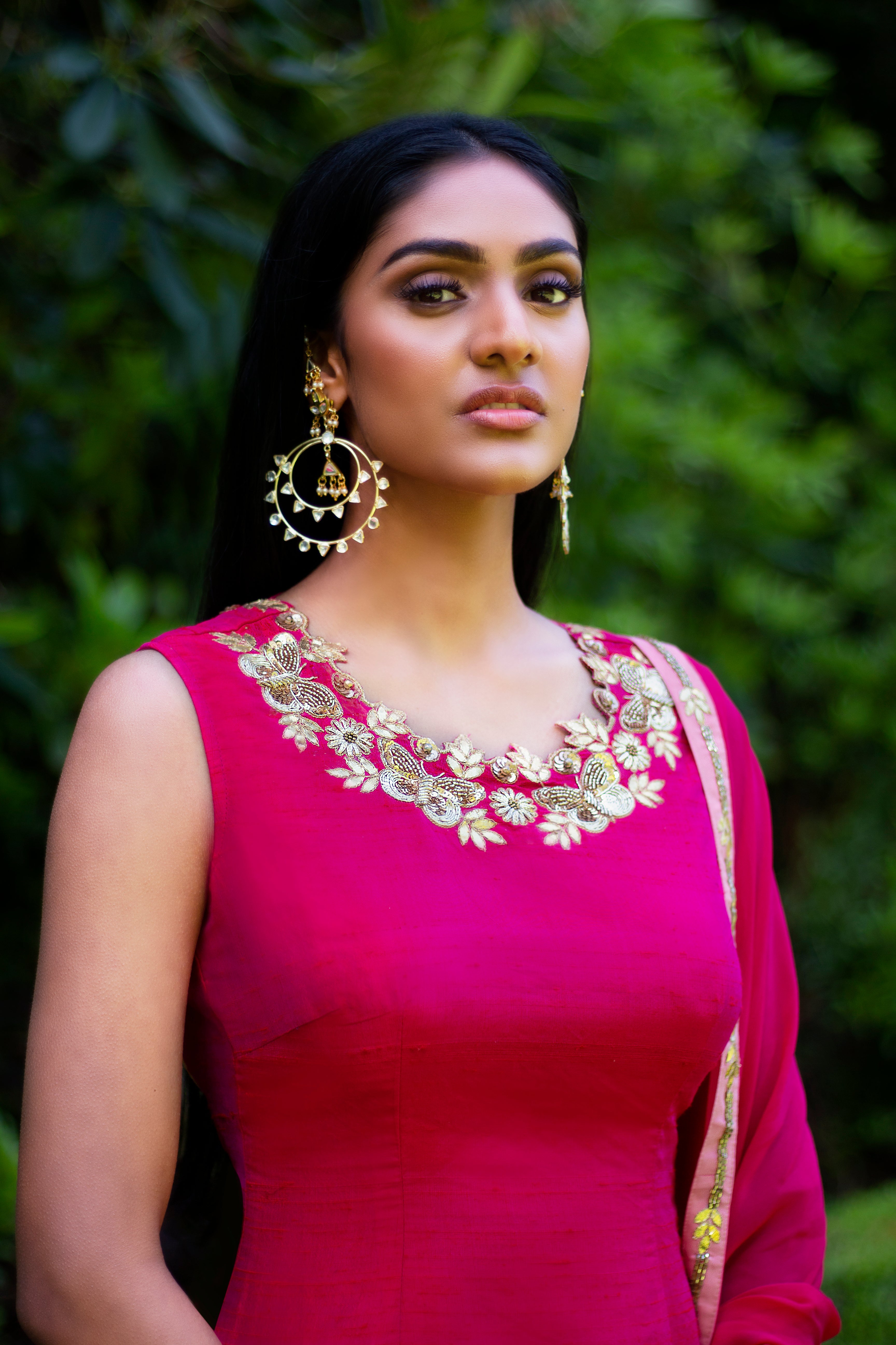 Pink and peach Rani Gharara sharara by Couture Mantra, featuring intricate embroidery and flowing fabric.