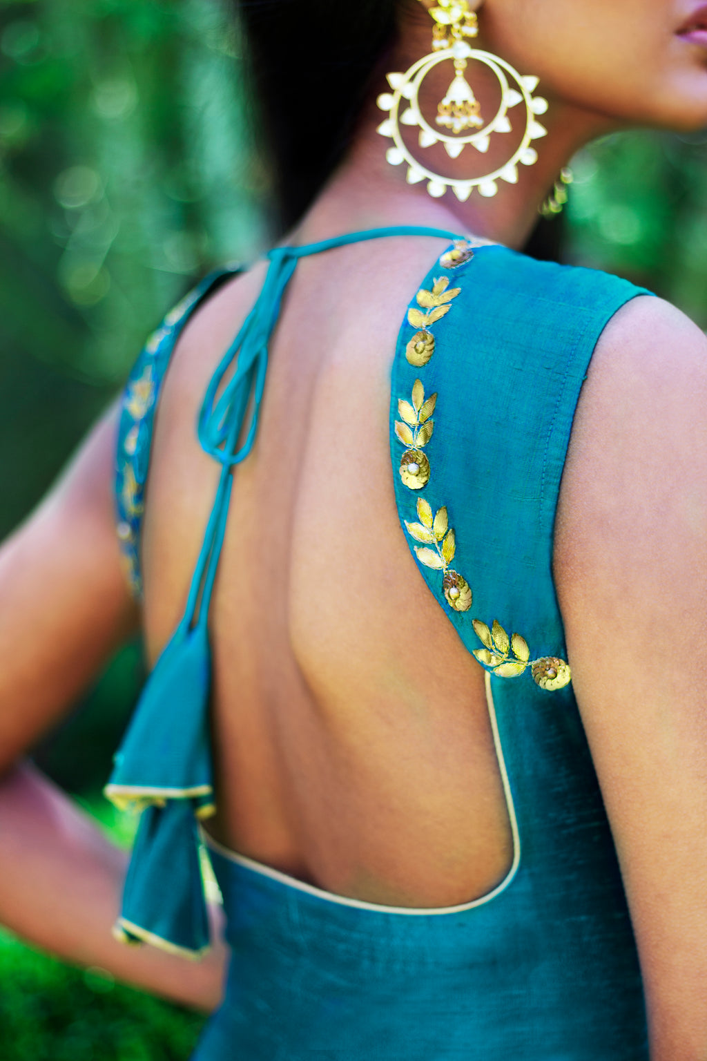 Peacock blue and yellow sharara pants by Couture Mantra, featuring intricate embroidery and traditional Indian ethnic wear.