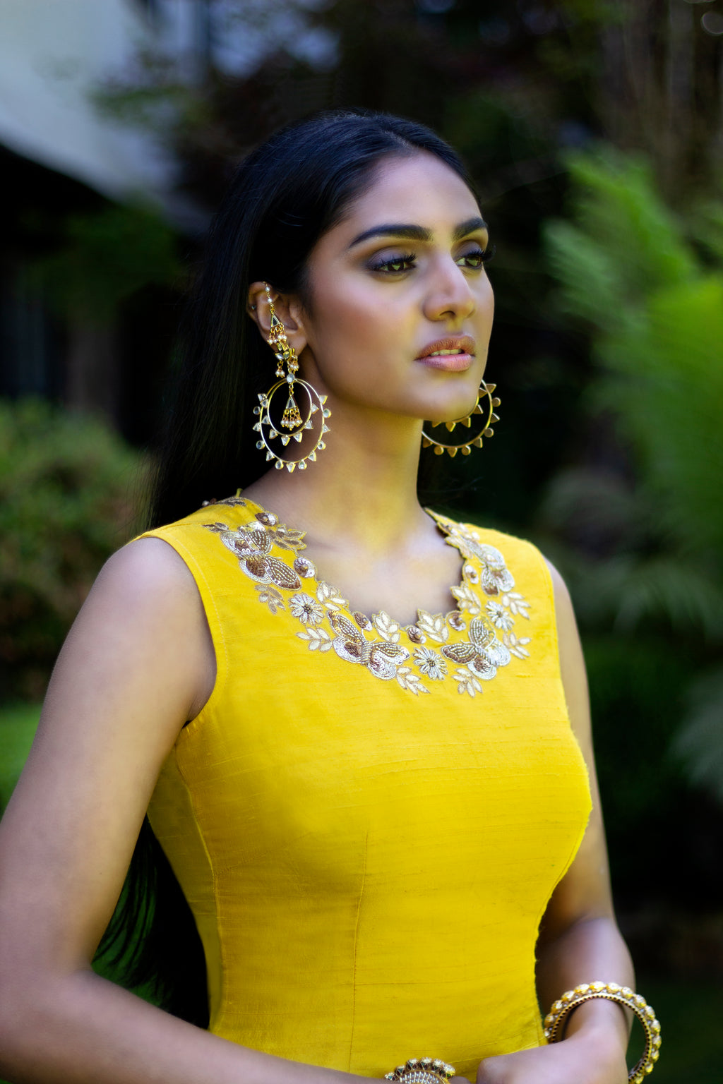 Yellow and pink Rani Gharara sharara by Couture Mantra, featuring traditional embroidery and vibrant fabric details.