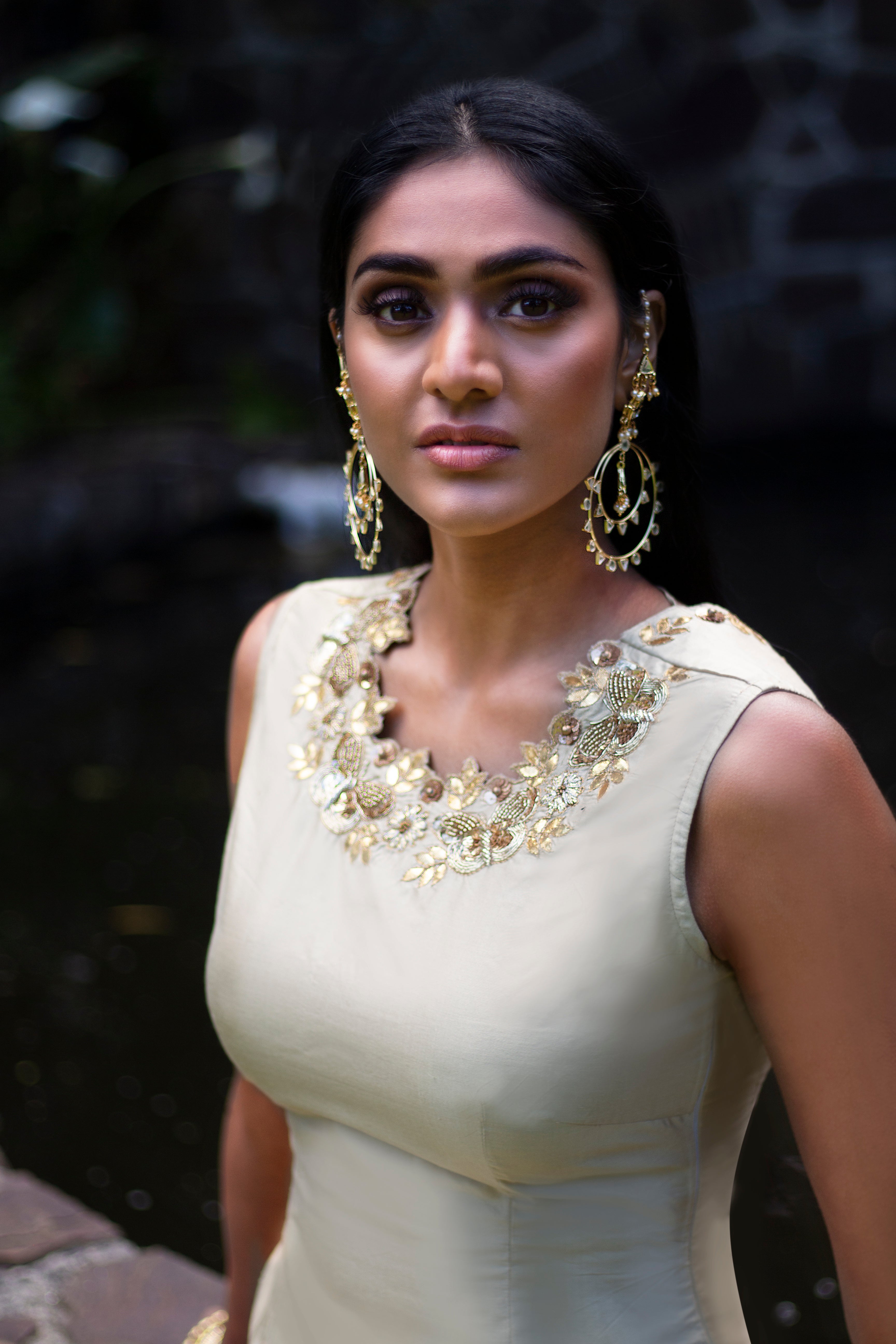 Beige and green Rani Gharara sharara by Couture Mantra, featuring intricate embroidery and traditional styling.