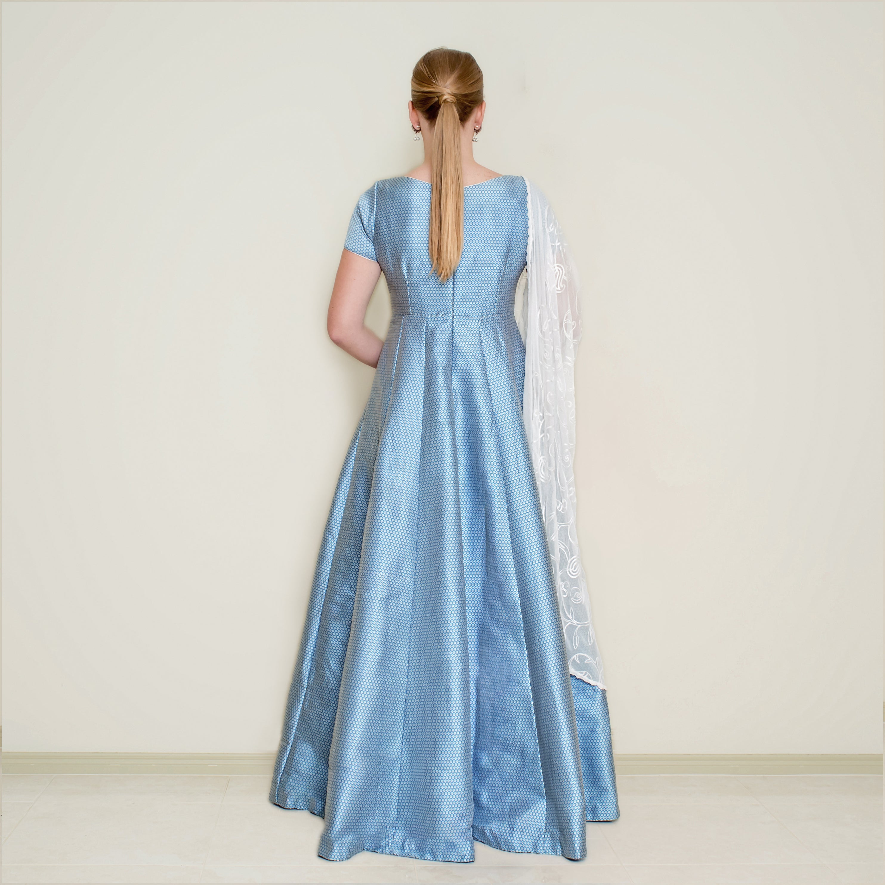 Blue Bindi Anarkali dress by Nakir featuring traditional embroidery and flowing fabric, ideal for festive occasions.