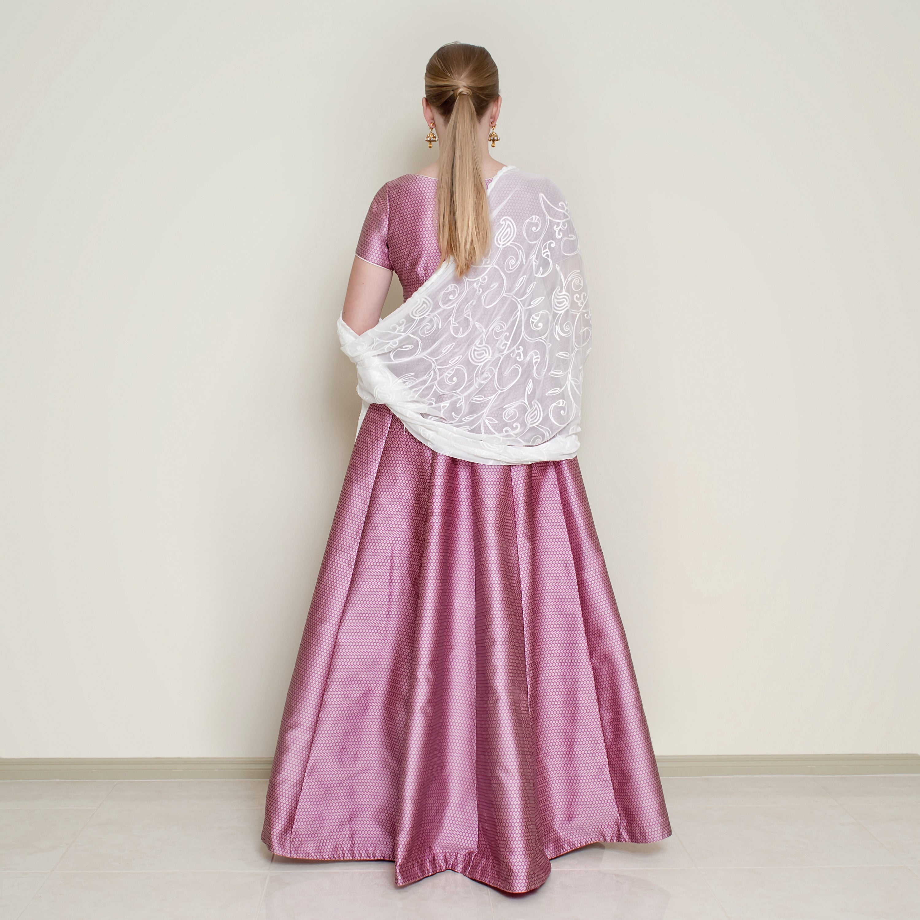 Pink Bindi Anarkali dress by Nakir featuring traditional embroidery and flowing fabric, perfect for festive occasions.
