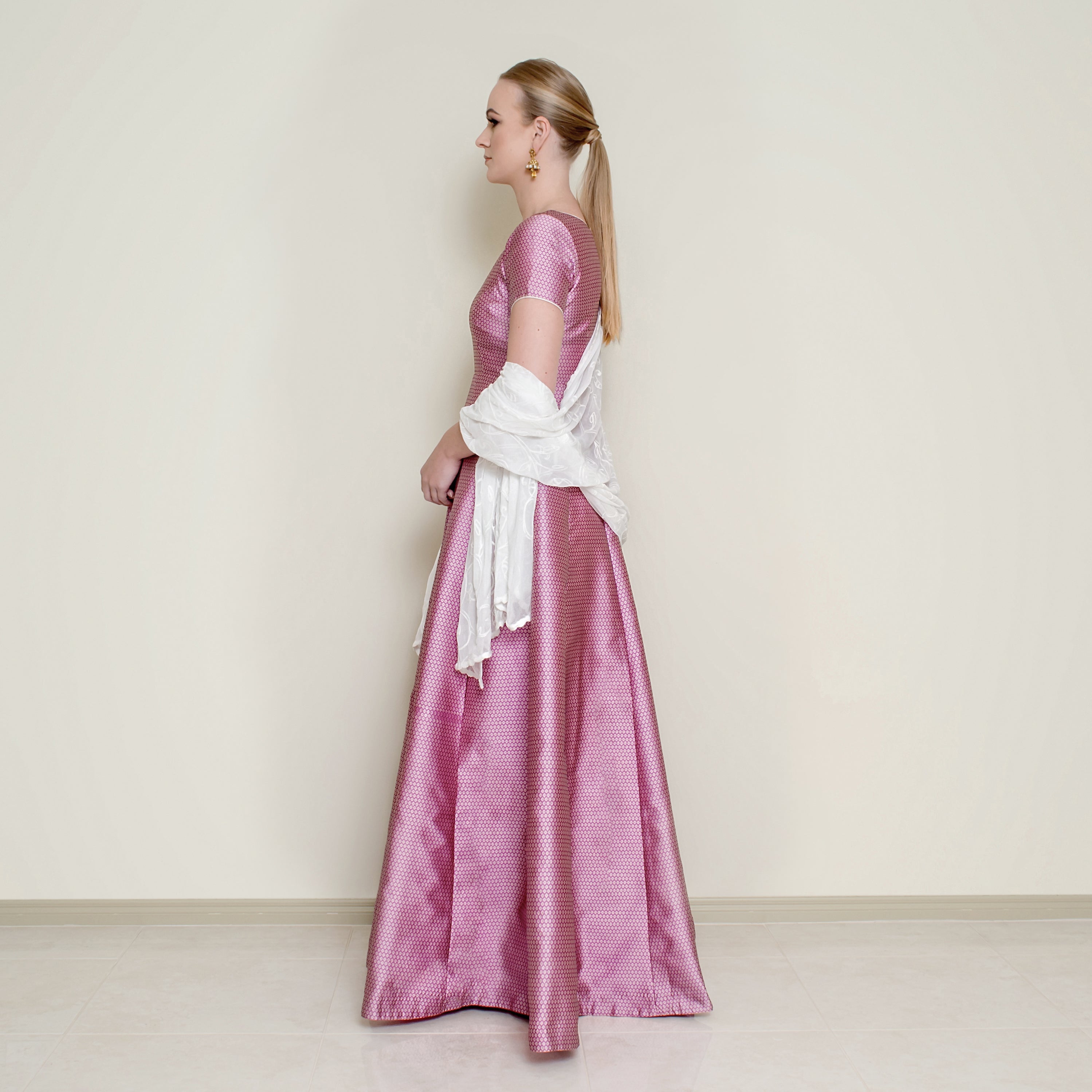 Pink Bindi Anarkali dress by Nakir featuring intricate embroidery and flowing fabric, perfect for traditional occasions.
