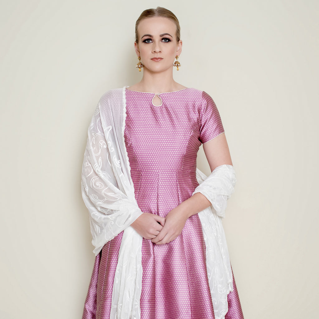 Pink Bindi Anarkali dress by Nakir featuring intricate embroidery and flowing fabric, perfect for traditional occasions.