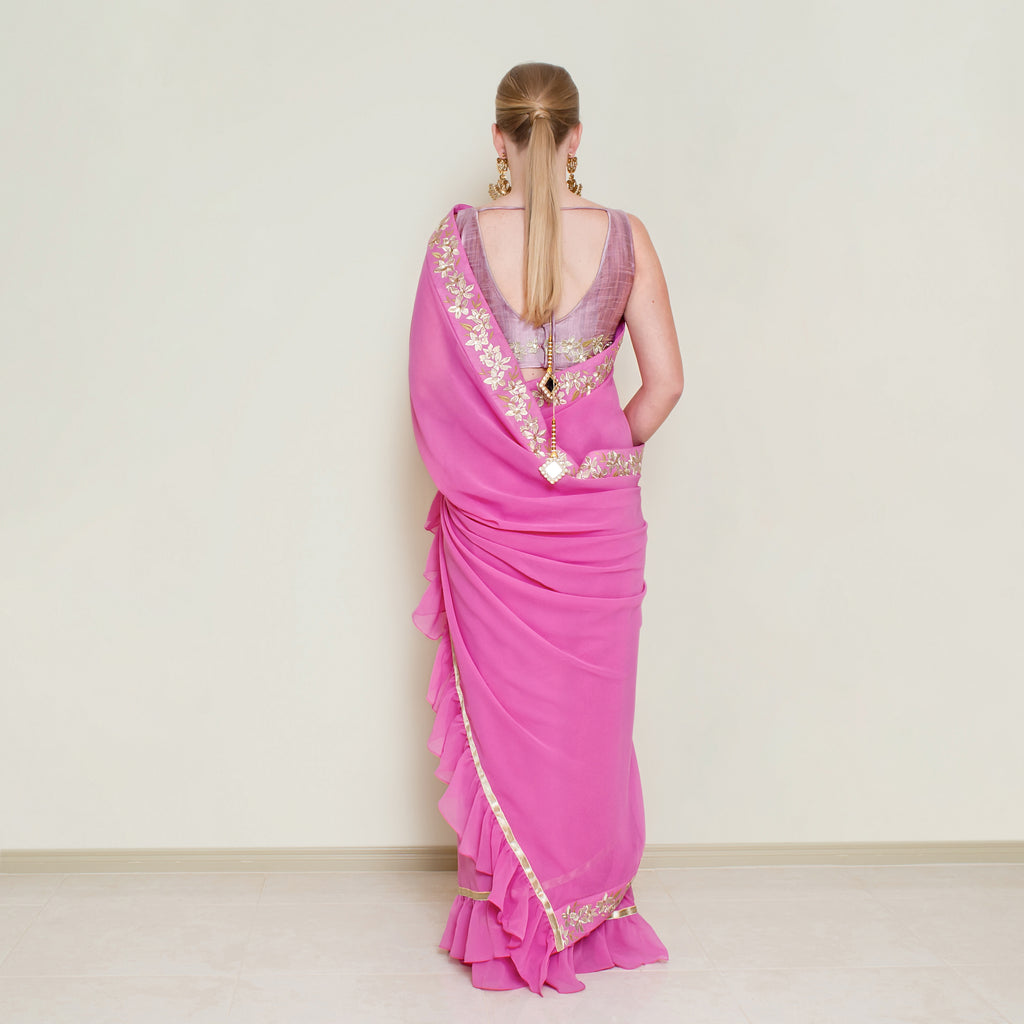 Nakir frill saree blouse in vibrant fabric with ruffle detailing, designed for elegant traditional Indian attire.