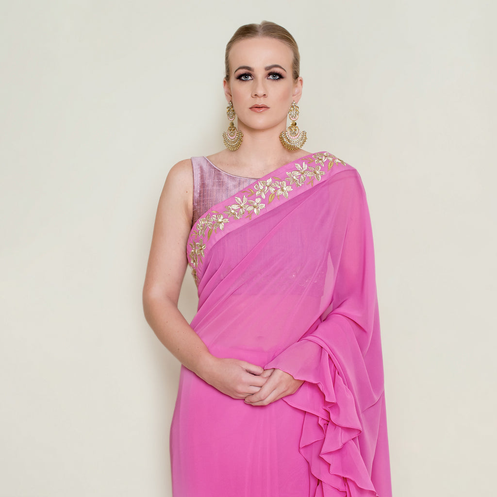 Nakir frill saree blouse with intricate embroidery and ruffled sleeves, stylish traditional Indian attire accessory.