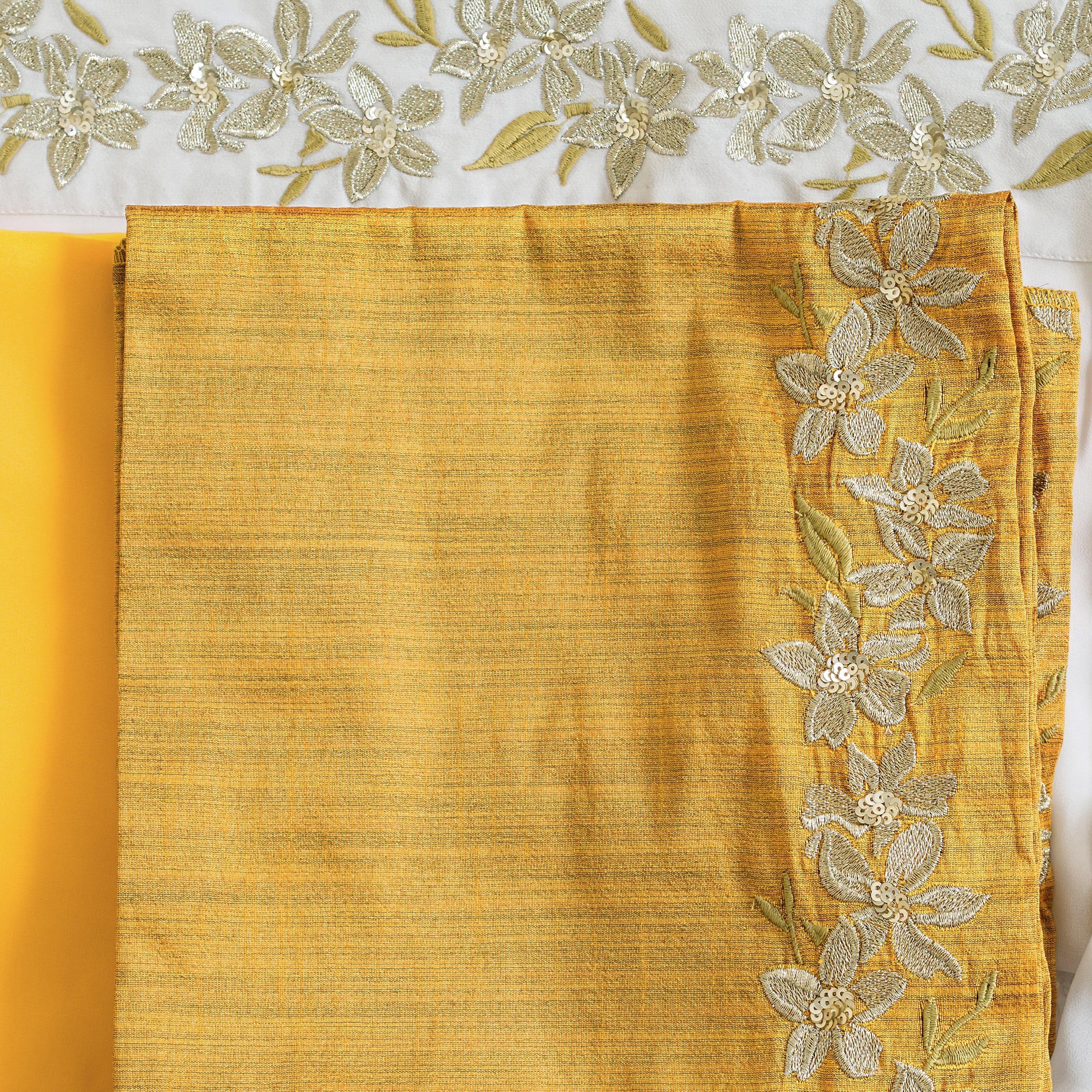 Nakir frill saree blouse in vibrant fabric with ruffle detailing, sleeveless design, and intricate embroidery.