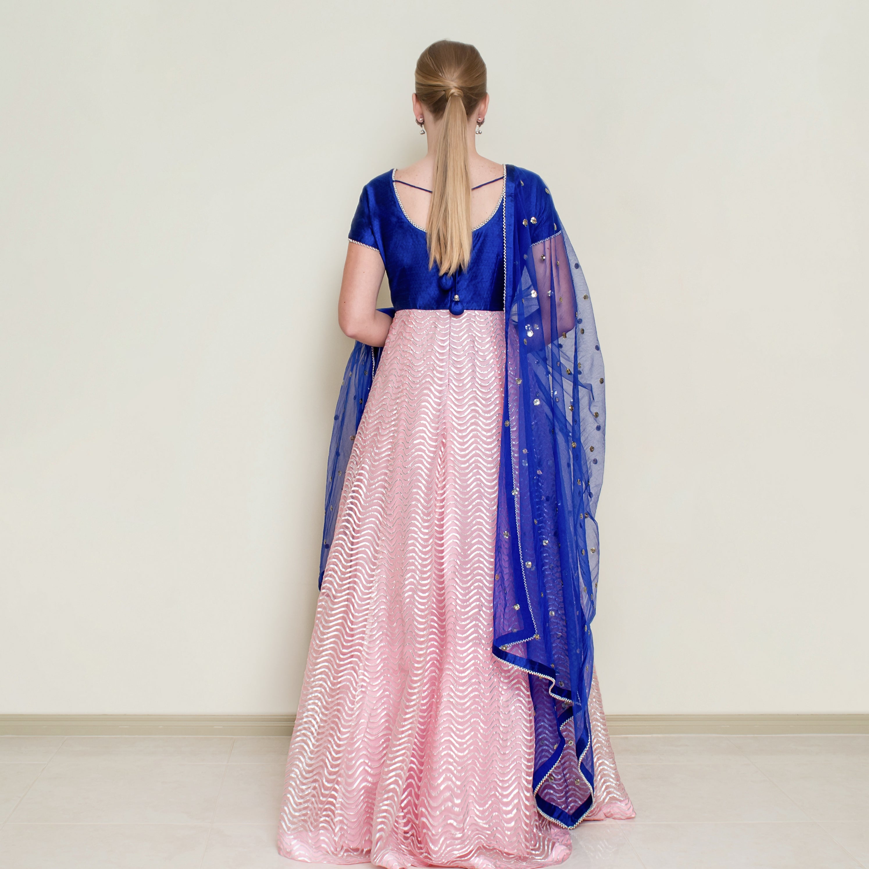 Pink Nakir Gotta Patti Anarkali dress with intricate embroidery and flowing fabric, traditional Indian ethnic wear for women.