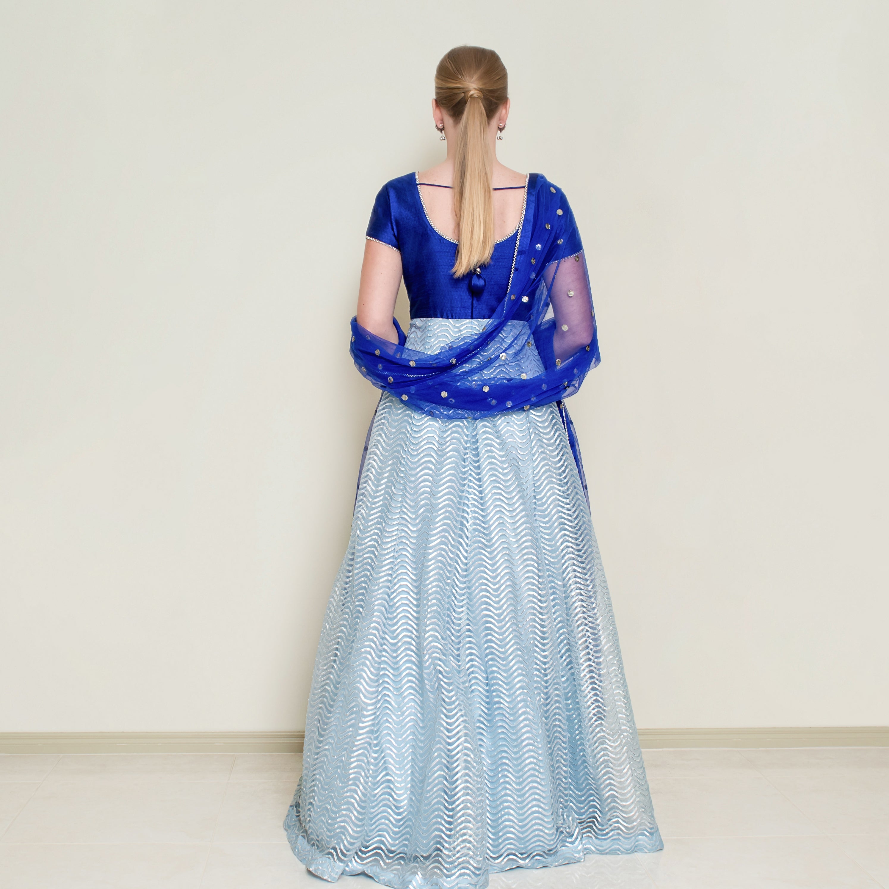 Powder blue Nakir Gotta Patti Anarkali dress with intricate embroidery and traditional design, perfect for festive occasions.