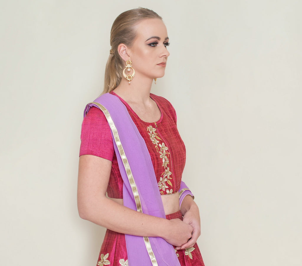 Red Pineapple Lehenga Set by Nakir featuring intricate embroidery and a flowing skirt, perfect for festive occasions.