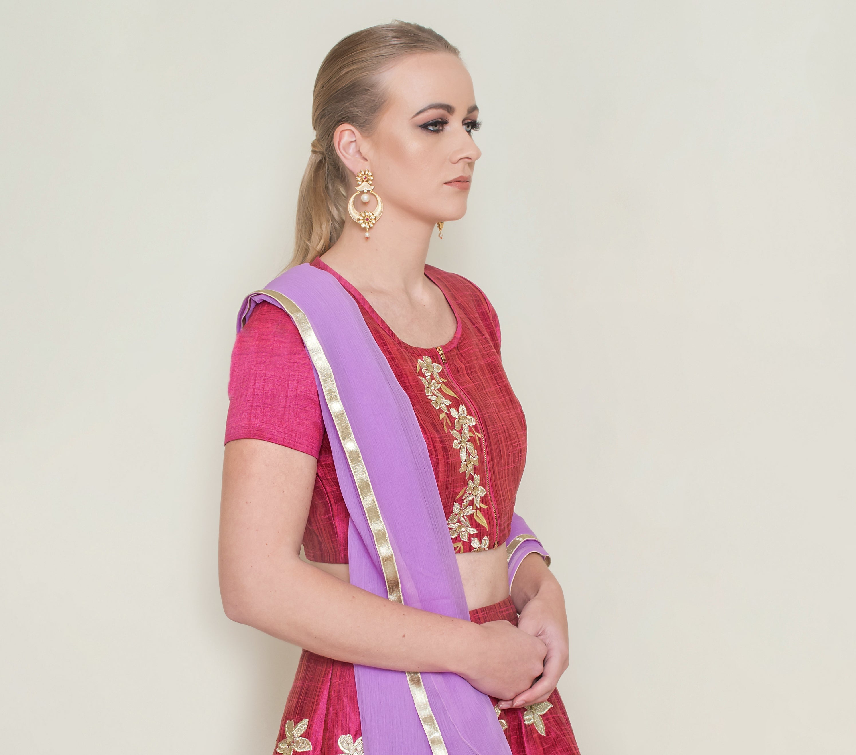 Red Pineapple Lehenga Set by Nakir featuring intricate embroidery and a flowing skirt, perfect for festive occasions.