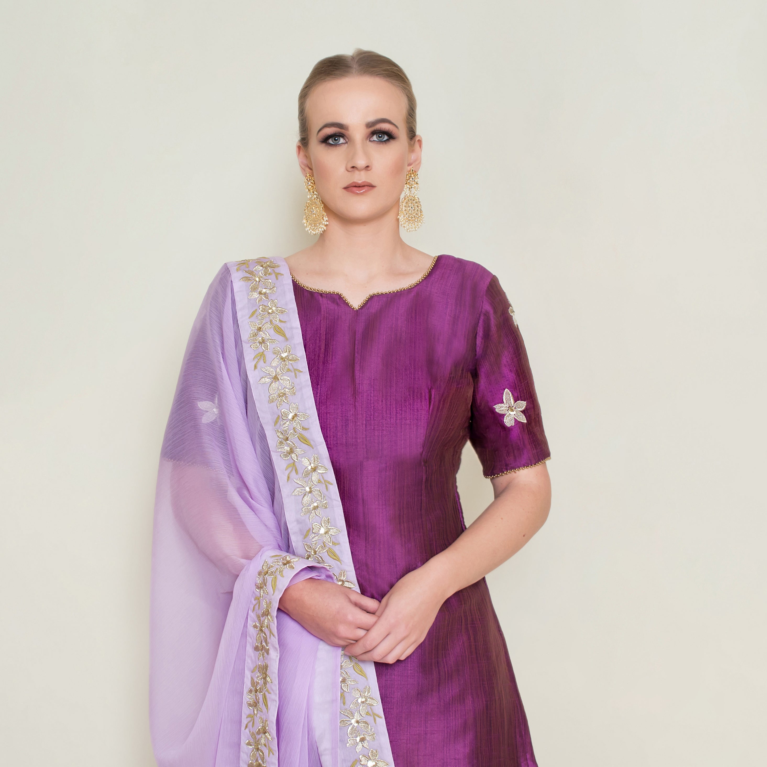 Purple embroidered Sharara set by Nakir, featuring intricate embroidery and traditional design, perfect for festive occasions.