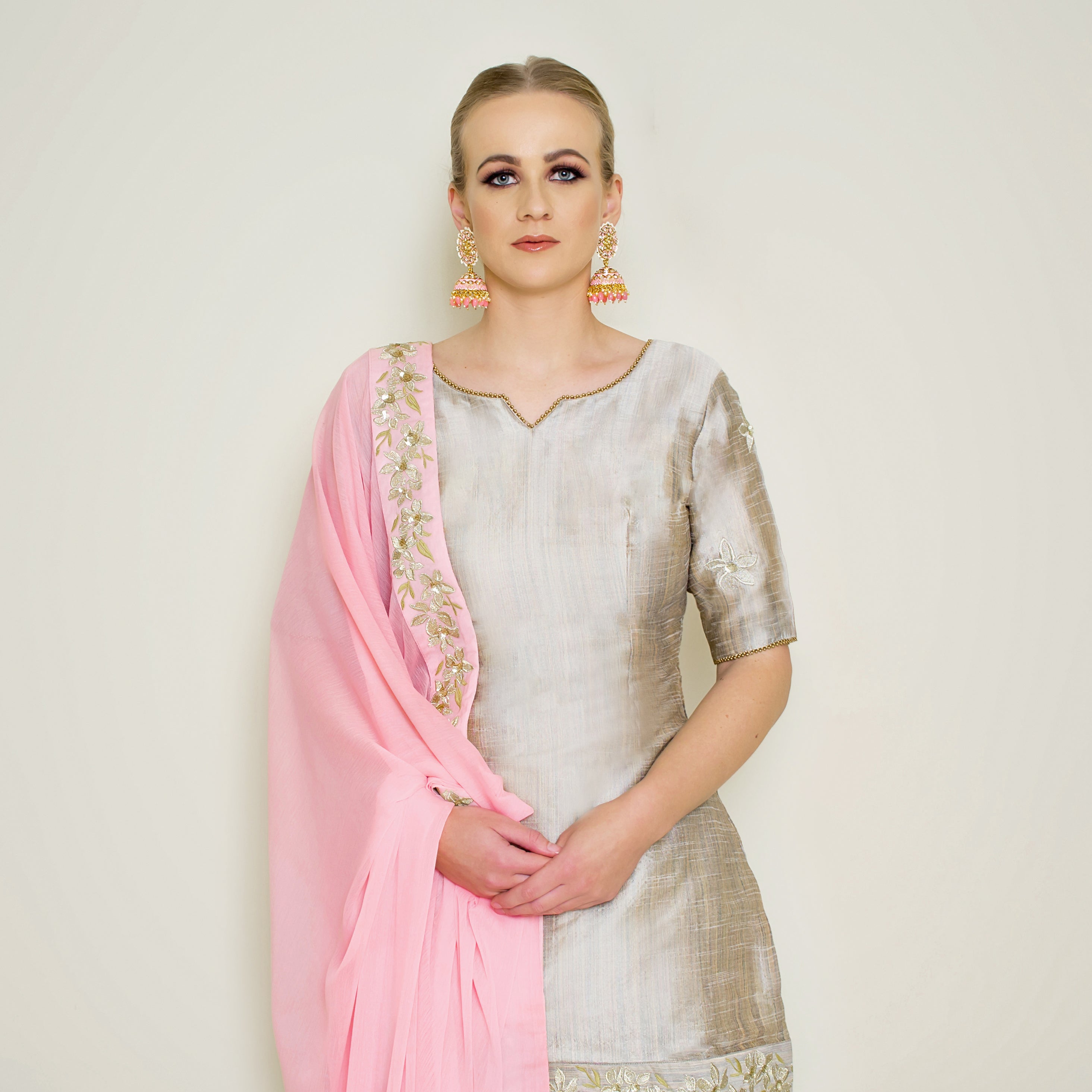 Stone grey embroidered Sharara set by Nakir featuring intricate embroidery and traditional design, perfect for festive occasions.