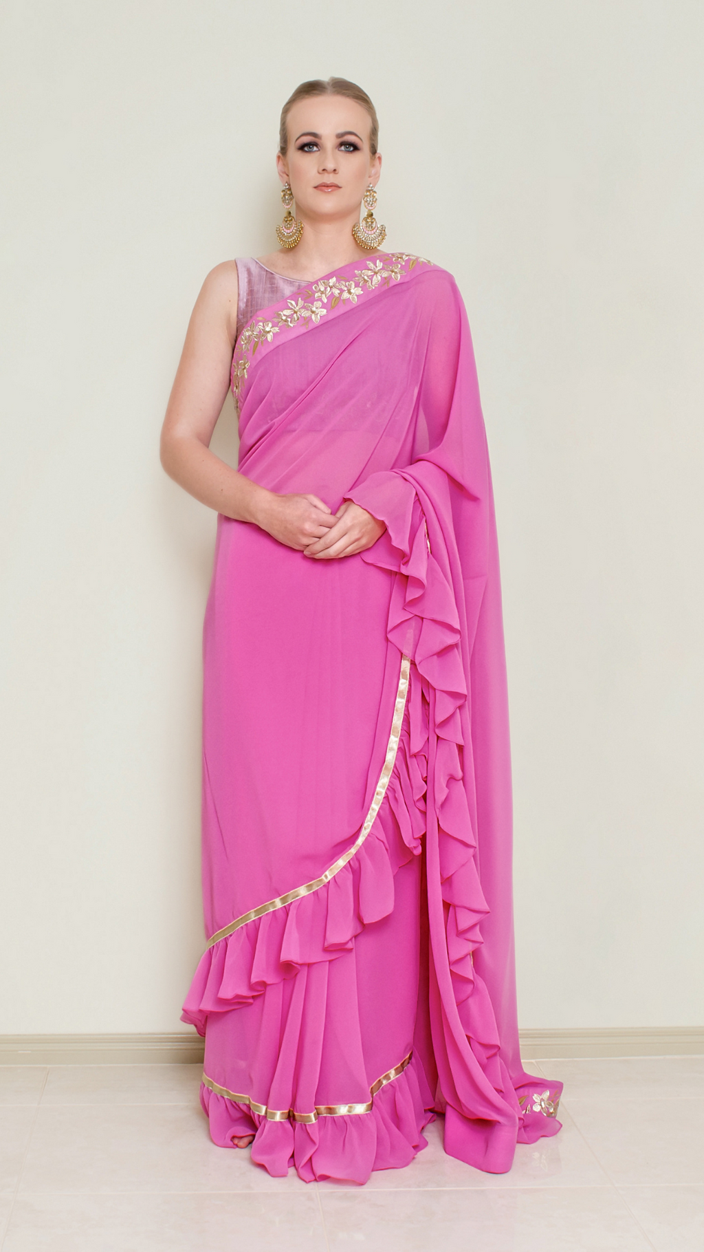 Nakir frill saree blouse with ruffled sleeves and intricate embroidery, designed for elegant traditional Indian attire.