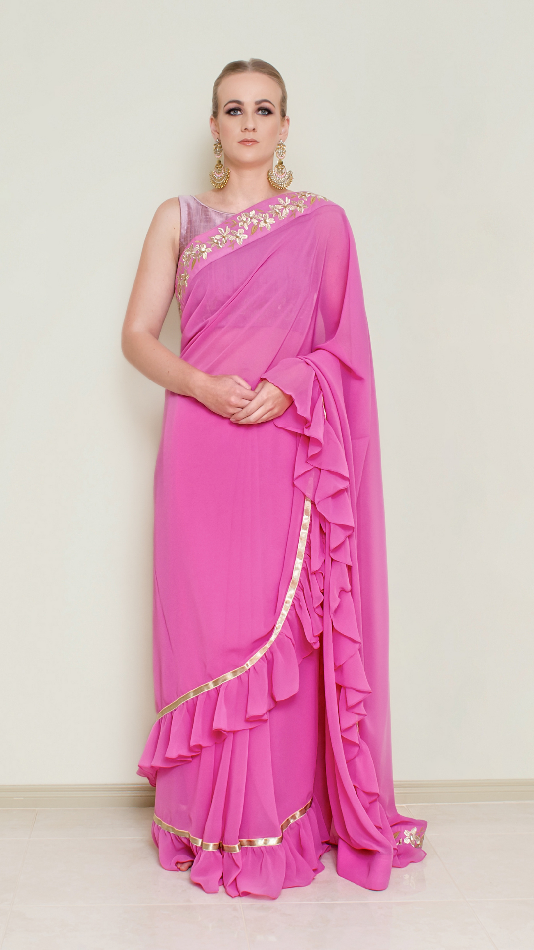 Nakir frill saree blouse with ruffled sleeves and intricate embroidery, designed for elegant traditional Indian attire.