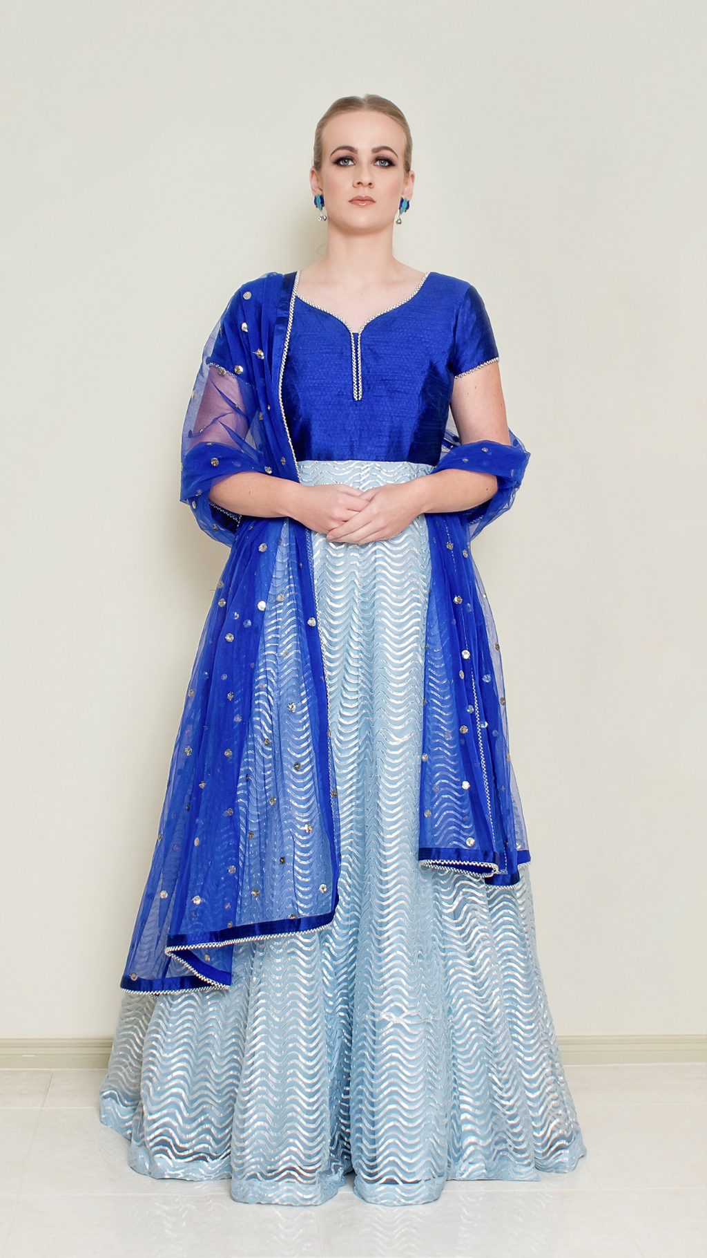 Powder blue Nakir Gotta Patti Anarkali dress with intricate embroidery and traditional design, displayed on a mannequin.