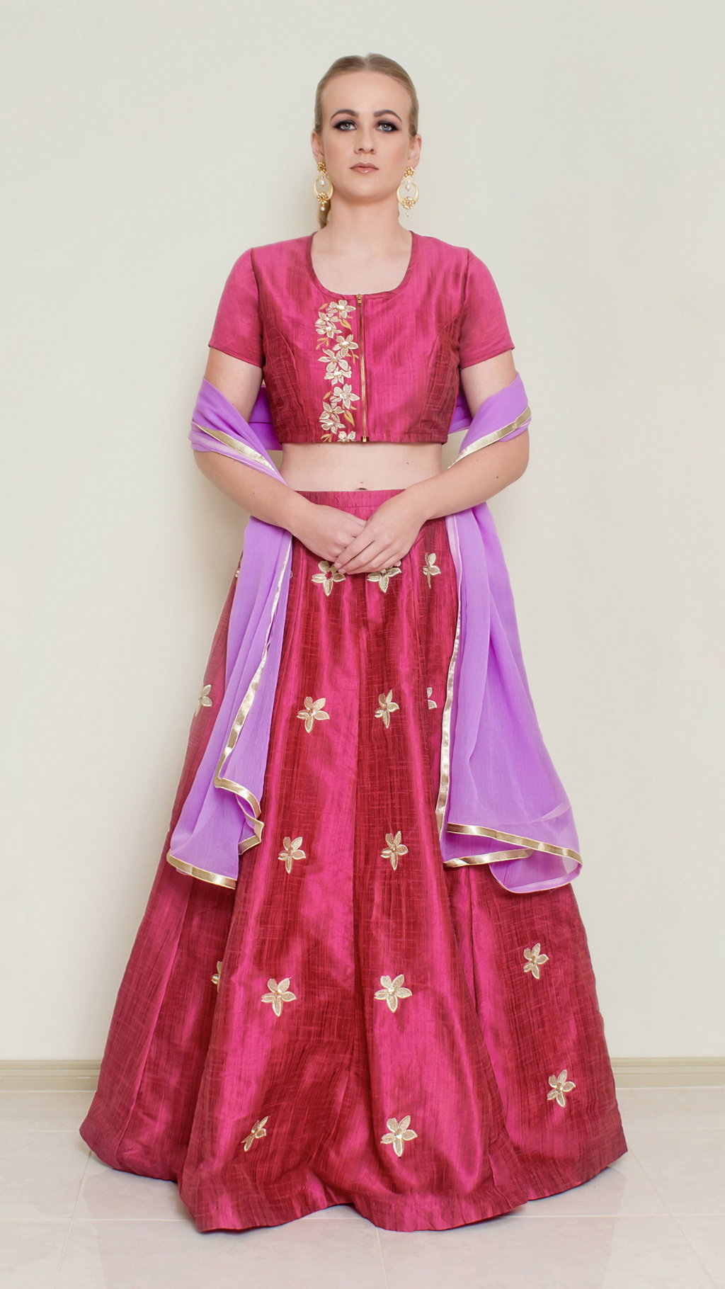 Red Pineapple Lehenga Set by Nakir, featuring a vibrant red lehenga with intricate embroidery and traditional design details.