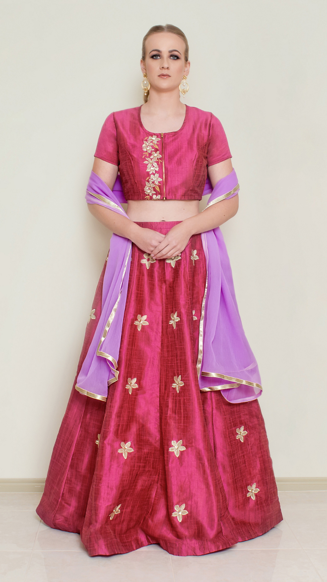 Red Pineapple Lehenga Set by Nakir, featuring a vibrant red lehenga with intricate embroidery and traditional design details.