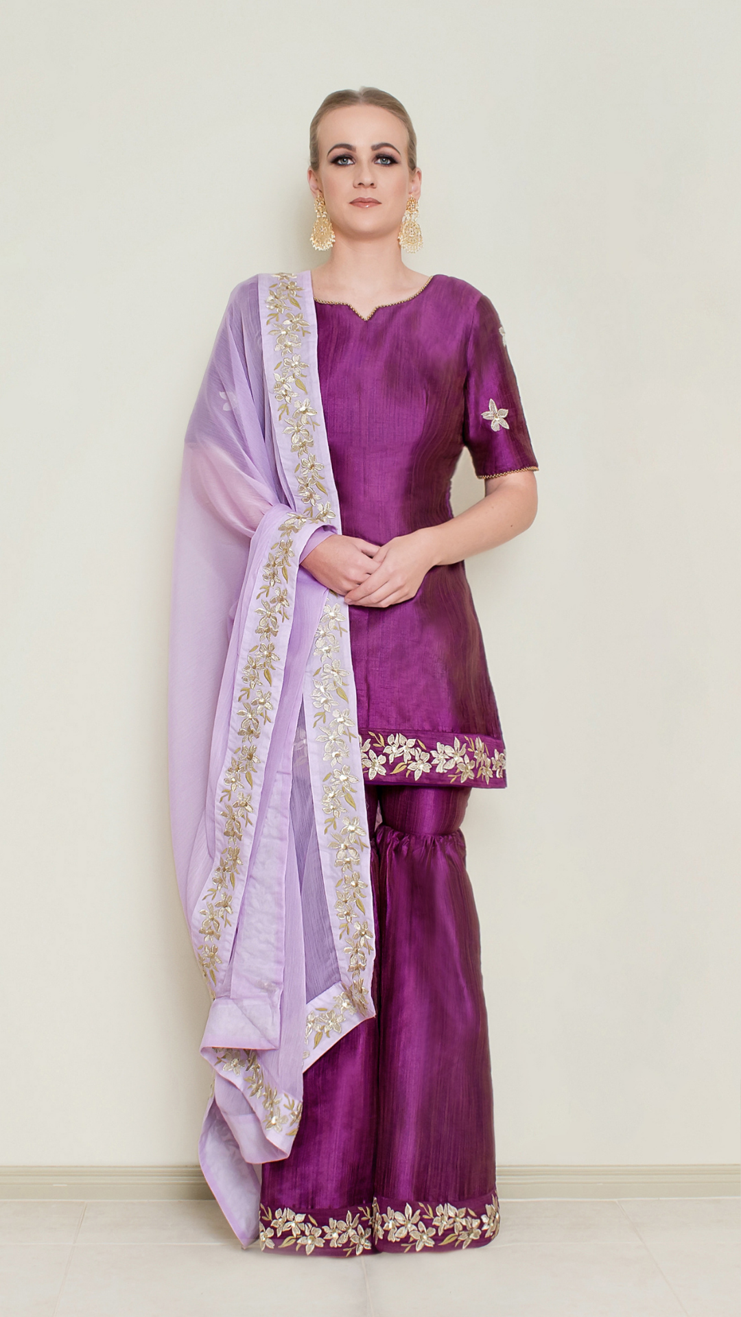 Purple embroidered Sharara set by Nakir, featuring intricate embroidery and flowing fabric, perfect for traditional occasions.